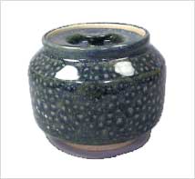 Dark blue speckled pottery jar with a rounded body and an open top, showcasing a glossy glaze typical of ceramic artistry.