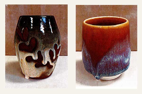 tie-dye-milk-honey Two handcrafted ceramic pottery mugs featuring rich glazes; one with a heart design, the other in warm orange tones.