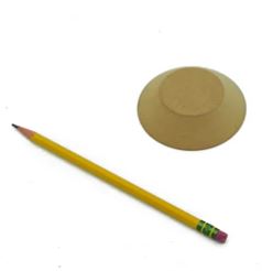 A yellow pencil next to a clay form, used for shaping or decorating pottery in ceramic art.