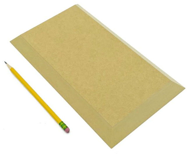 Yellow pencil next to a rectangular beige ceramic bat for shaping and decorating pottery at Georgies Ceramic & Clay Company.