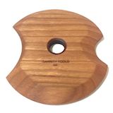 Wooden pottery trimming tool with a central hole, featuring a unique apple shape for easy handling and precision in ceramics.