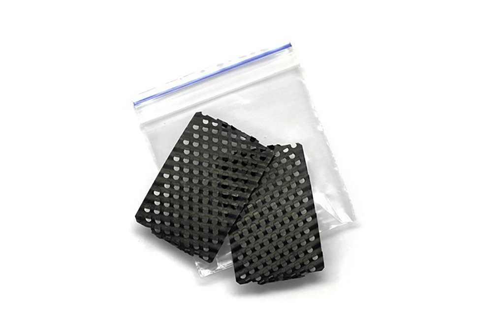 Black ceramic wedge tools in a resealable bag, ideal for shaping and smoothing clay in pottery and sculpting projects.
