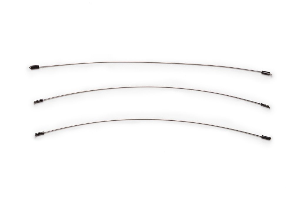 Three ceramic wire cutters with curved stainless steel wires and rubber grips, used for shaping and trimming clay.