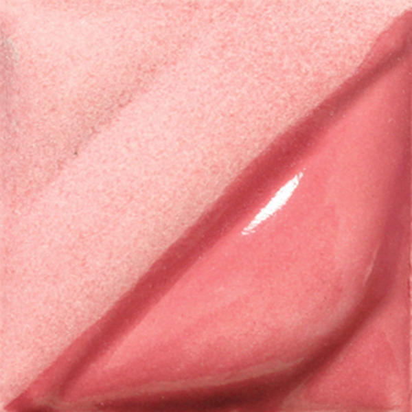 Close-up of a pink ceramic glaze sample with a smooth, glossy finish and soft matte texture, showcasing color variation.