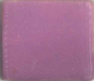 Ceramic color swatch of a bright lavender glaze, showcasing a smooth, glossy finish ideal for pottery and sculpture.
