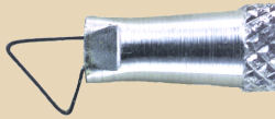 Close-up of a ceramic loop tool, featuring a metal handle and a wire loop, used for shaping and carving clay.