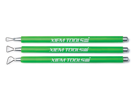 Three green Xiem Tools ceramic trimming tools with loop ends, designed for precise decorating and shaping in pottery.