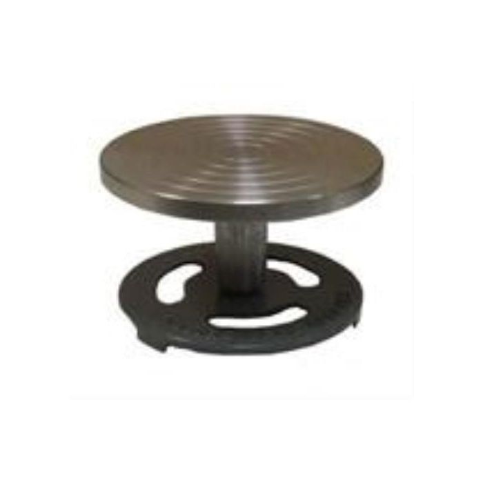 Ceramic pottery wheelhead with grooved metal surface for shaping clay, mounted on a sturdy base for stability.