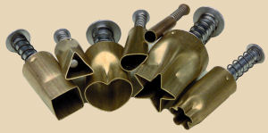 Brass clay cutters in various shapes, including heart, star, and triangle, with metal handles for ceramic crafting.