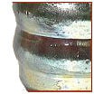Close-up of a pottery piece showcasing layered glazes in shades of blue, brown, and cream, highlighting ceramic textural details.