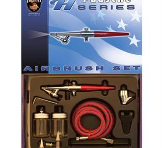 Airbrush set featuring tools for ceramic decoration, including an airbrush, jars, and nozzle attachments.