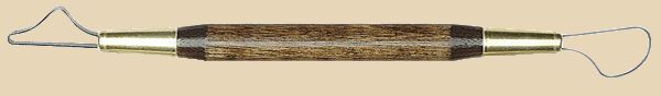 Ceramic rib tool with wooden handle and wire ends, used for shaping and smoothing clay in pottery.