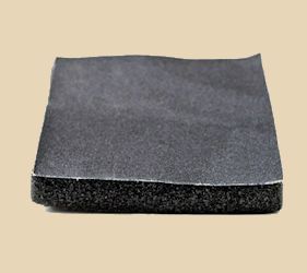Black ceramic sanding sponge used for smoothing pottery and clay surfaces after firing, ideal for finishing touches.