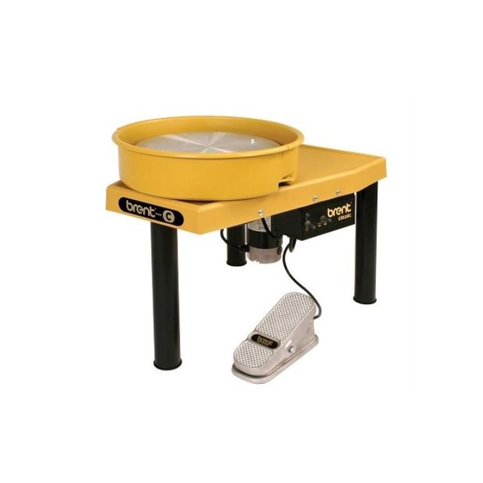Brent C pottery wheel in yellow with a foot pedal, used for throwing clay and creating pottery items.