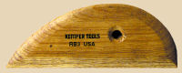 Wooden rib tool for shaping clay, marked with SIMPLE TOOLS, RB2 USA, essential for pottery and ceramic sculpting.