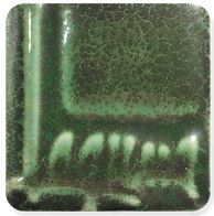 Glossy dark green ceramic glaze sample with a rich, crackled texture, ideal for pottery and decorative pieces.