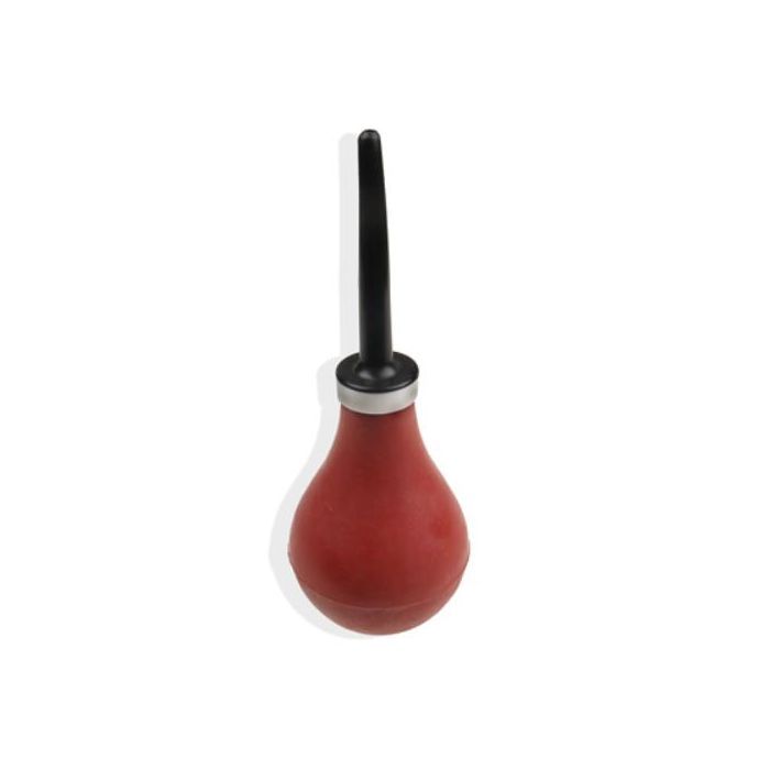 Red rubber squeeze bulb with a black tip, used for applying glazes or cleaning clay tools in ceramics.