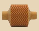 Textured ceramic roller with a zigzag pattern, ideal for creating decorative surface designs on pottery and clay projects.