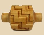 Textured wooden pottery tool for creating patterns in clay, ideal for decorative ceramics and studio projects.