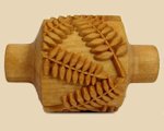 Textured ceramic roller with leaf patterns designed for imprinting designs on clay surfaces. Ideal for pottery and sculpture.