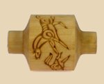 Bamboo pottery tool featuring decorative animal carvings, used for texture and design in ceramics and clay projects.