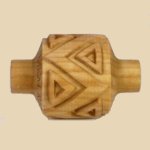 Carved wooden ceramic tool with geometric designs, used for texture in clay pottery and sculpture at Georgies Ceramic & Clay Company.