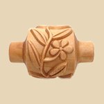 Carved wooden stylus with floral design, used for decorating ceramics and pottery at Georgies Ceramic & Clay Company.