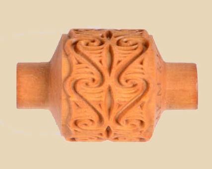 Decorative clay texture roller featuring intricate swirls and patterns, ideal for pottery and ceramic decoration.