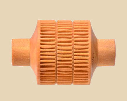 Ceramic trimming tool with ribbed surface, designed for shaping and smoothing clay in pottery and sculpture.