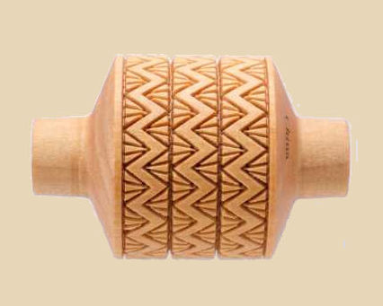 Wooden ceramic texture roller with zigzag pattern for decorating pottery and clay surfaces at Georgies Ceramic & Clay Company.