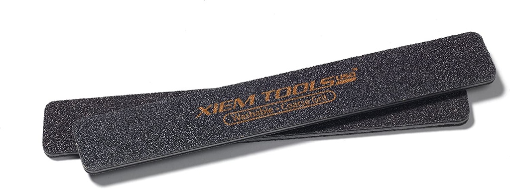 Two Xiem Tools silicone ribs used for smoothing and shaping clay in pottery. Black surface with a textured finish for precision work.