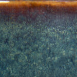 Gradient glaze featuring deep green hues transitioning to a rich brown edge, ideal for pottery finishing and decoration.