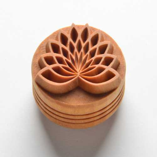 Wooden stamp with a detailed lotus flower design, ideal for decorating clay or pottery surfaces at Georgies Ceramic & Clay Company.