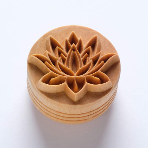 Detailed wooden stamp with an intricate lotus flower design, ideal for decorating ceramics or pottery projects.