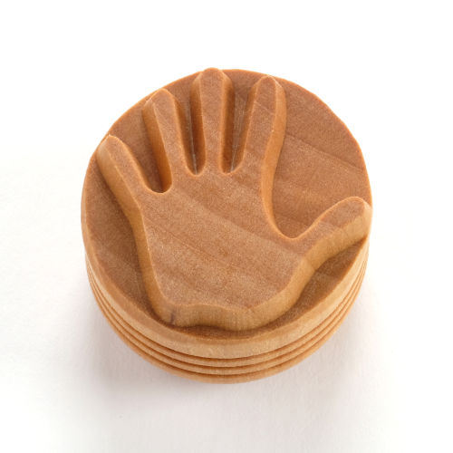 Hand-shaped clay stamp for pottery, ideal for adding texture to ceramic projects; made from durable wood.