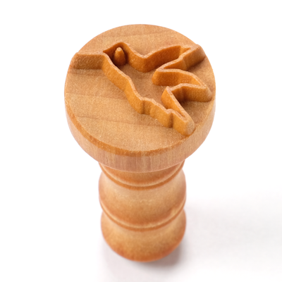 Wooden pottery stamp featuring a hummingbird design, used for decorating clay and ceramics at Georgies Ceramic & Clay Company.