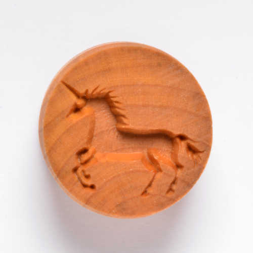 Carved unicorn stamp made from terracotta, ideal for decorating pottery and clay projects at Georgies Ceramic & Clay Company.