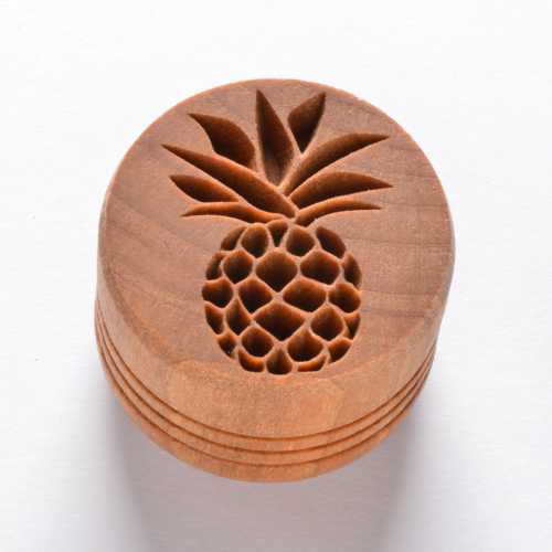Wooden pottery stamp featuring a pineapple design, ideal for decorating clay and ceramics. Great for texture and detail.