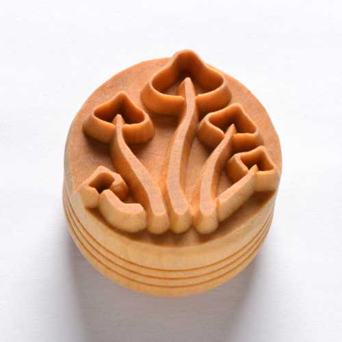 Wooden texture stamp featuring delicate floral motifs, used for decorating clay pottery or ceramics at Georgies Ceramic & Clay Company.