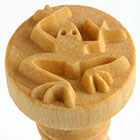Ceramic monkey stamp tool with intricate detailing for decorating pottery and clay projects at Georgies Ceramic & Clay Company.
