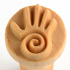 Ceramic hand stamp featuring a spiral design, ideal for texturing pottery and clay projects at Georgie's Ceramic & Clay Company.