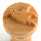 Wooden stamp featuring a bird design, used for decorating pottery and ceramics at Georgies Ceramic & Clay Company.