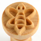 Wooden bee stamp for clay decoration, showcasing intricate carving, ideal for pottery and ceramic crafting.