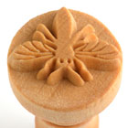 Clay stamp featuring a detailed floral design, ideal for decorating ceramics and pottery projects at Georgies Ceramic & Clay Company.