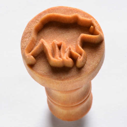 Ceramic stamp tool featuring a bear design, used for decorating pottery and clay surfaces at Georgies Ceramic & Clay Company.
