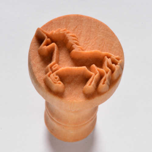 Wooden stamp featuring a detailed unicorn design, ideal for decorating pottery and ceramics. Perfect for clay projects.