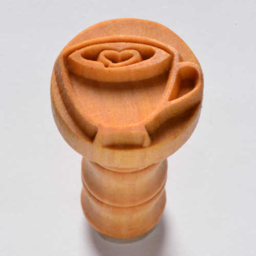 Ceramic handle stamp featuring a heart-shaped cup design, ideal for decorating pottery and clay projects.