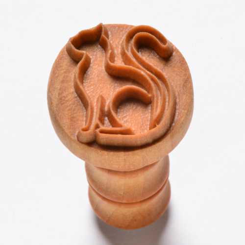 Cat-shaped clay stamp for decorating pottery, crafted from wood, ideal for imprinting designs in ceramics.