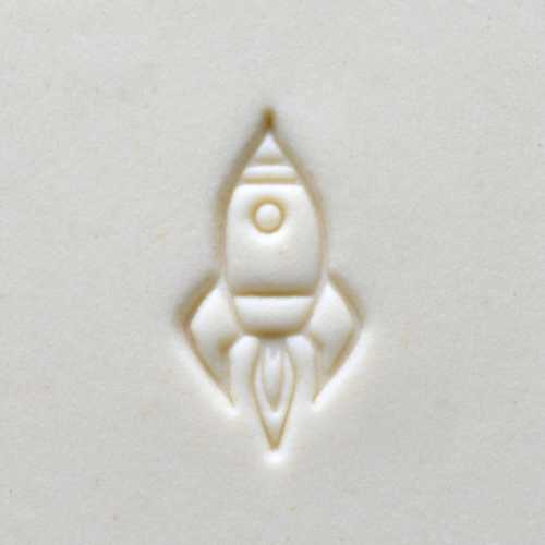 Embossed rocket design on light clay surface, ideal for ceramic decoration or sculpture techniques.