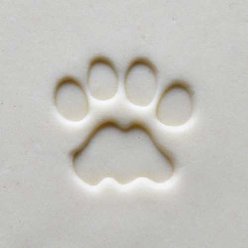 A clay slab with an impression of a pet's paw print, ideal for creating personalized ceramic keepsakes.